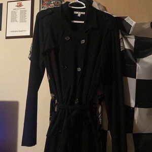 Cute and flattering button up long black jacket